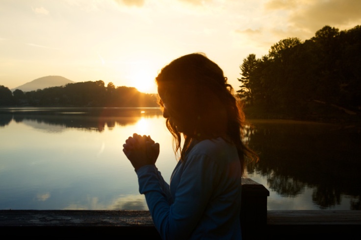 praying by lake